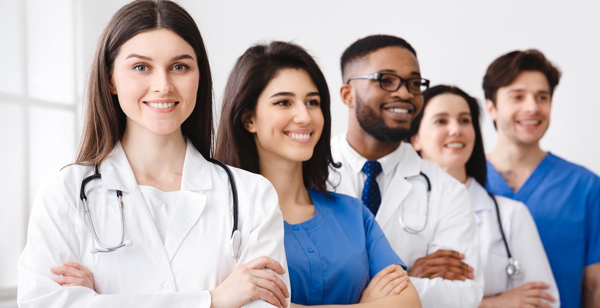 Medical staff Standing In Line In Hospital