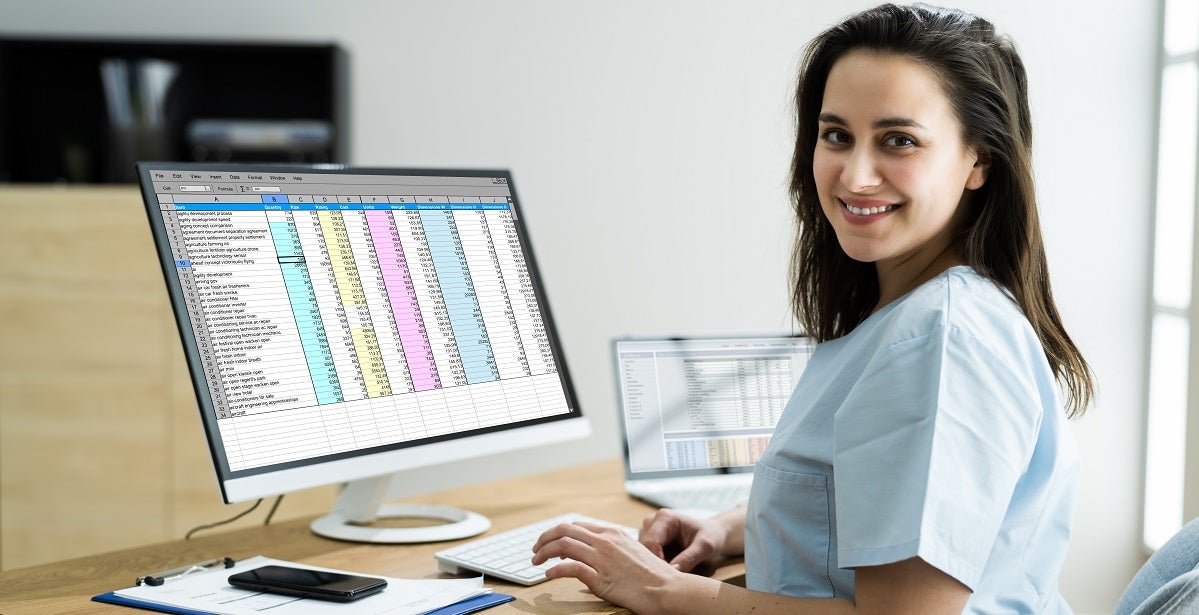 Nurse looking at the Medical Bill Codes And Spreadsheet Data